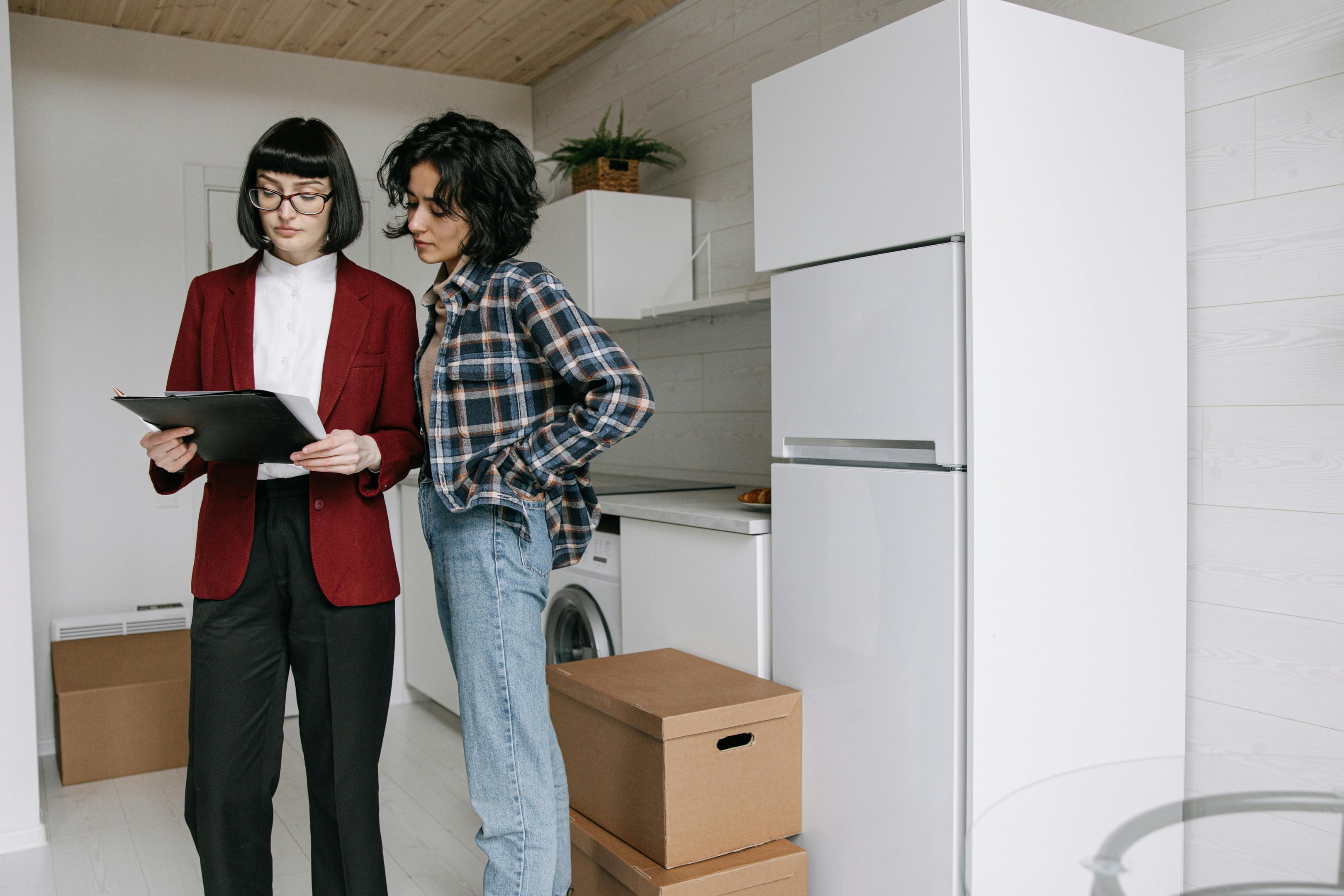 Real estate investor meets with motivated seller to walk through their property.