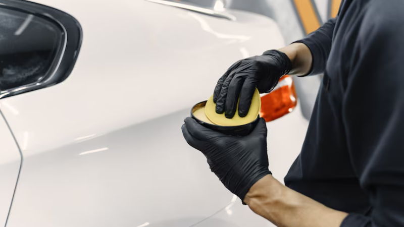 A professional using non alcoholic cleaner for PPF
