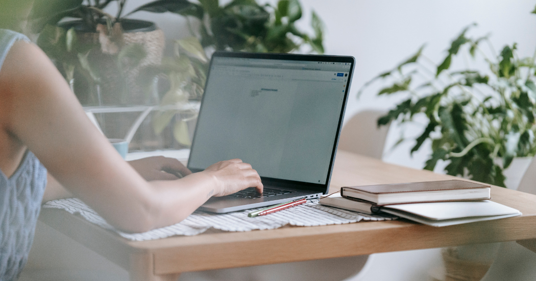 A woman working on laptop "escort" for onlyfans