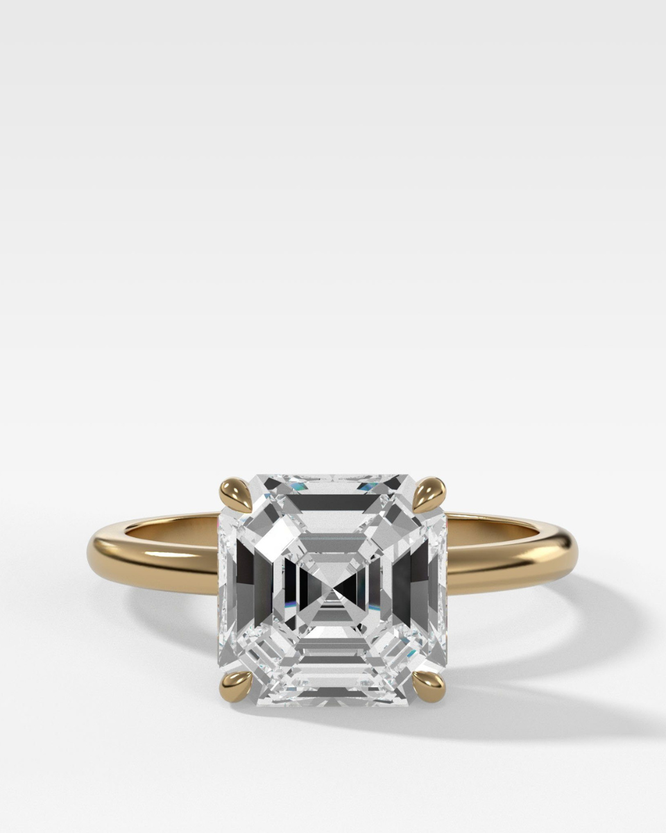 GOODSTONE THIN AND SIMPLE SOLITAIRE ENGAGEMENT RING WITH AN ASSCHER CUT DIAMOND