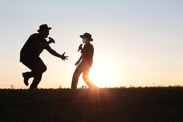 An image of a father and his son singing in the sunset. 