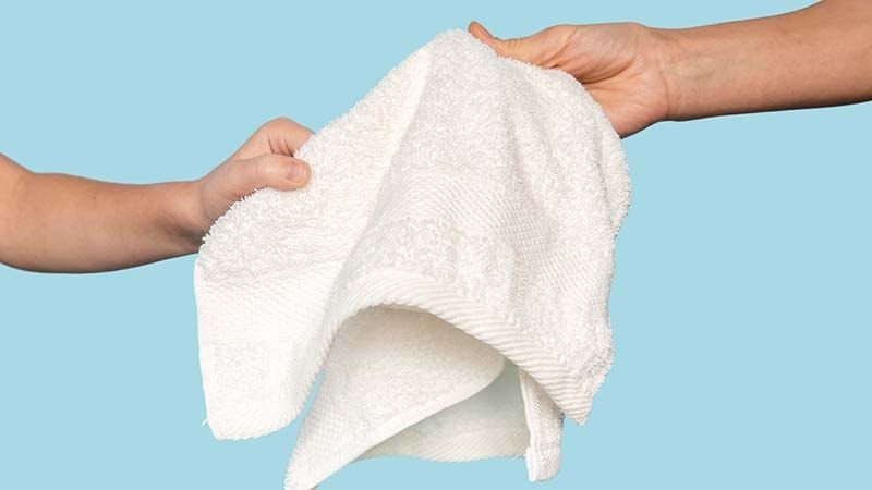 Siblings sharing a towel