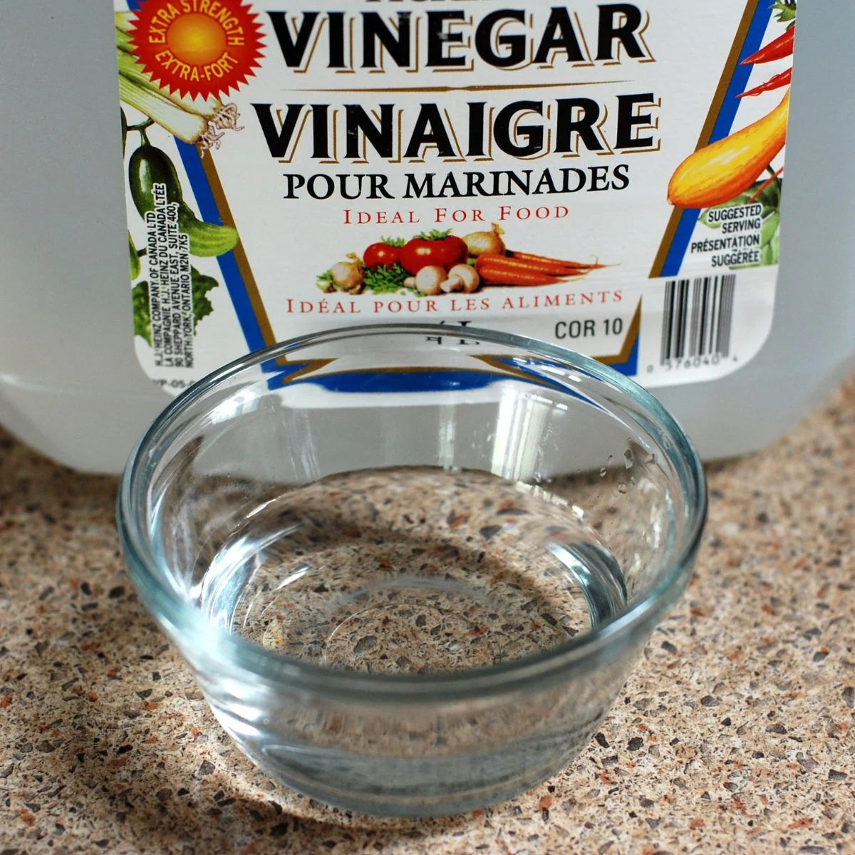 Make a descaling solution using vinegar and water