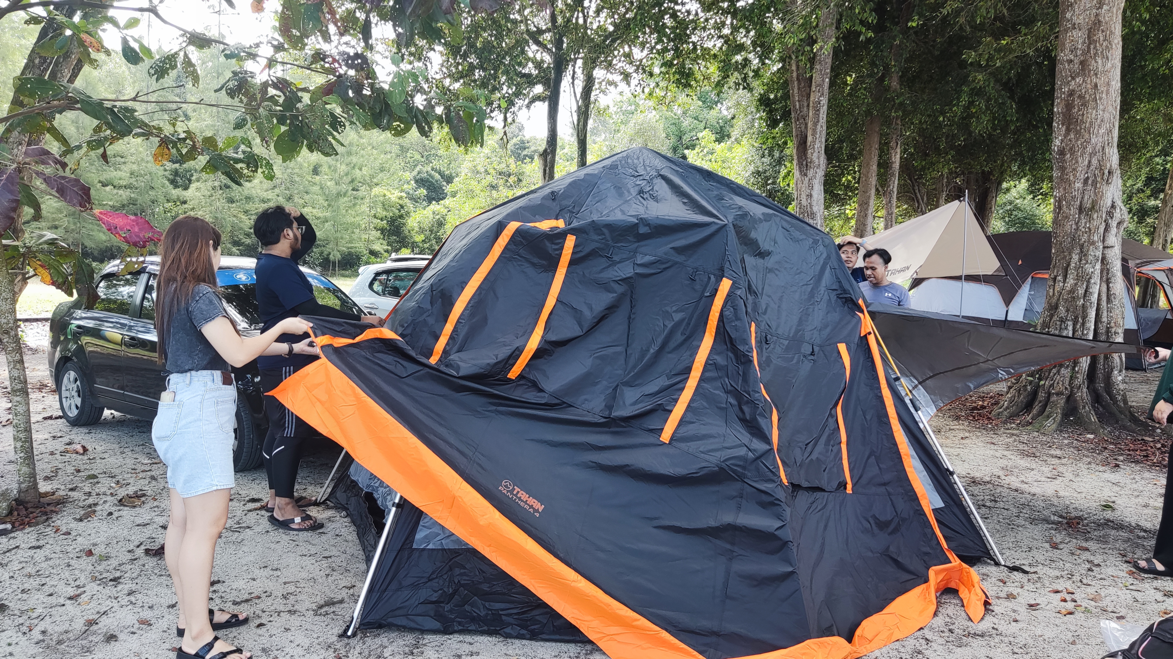 A group of people enjoying camping in Malaysia's diverse camping sites