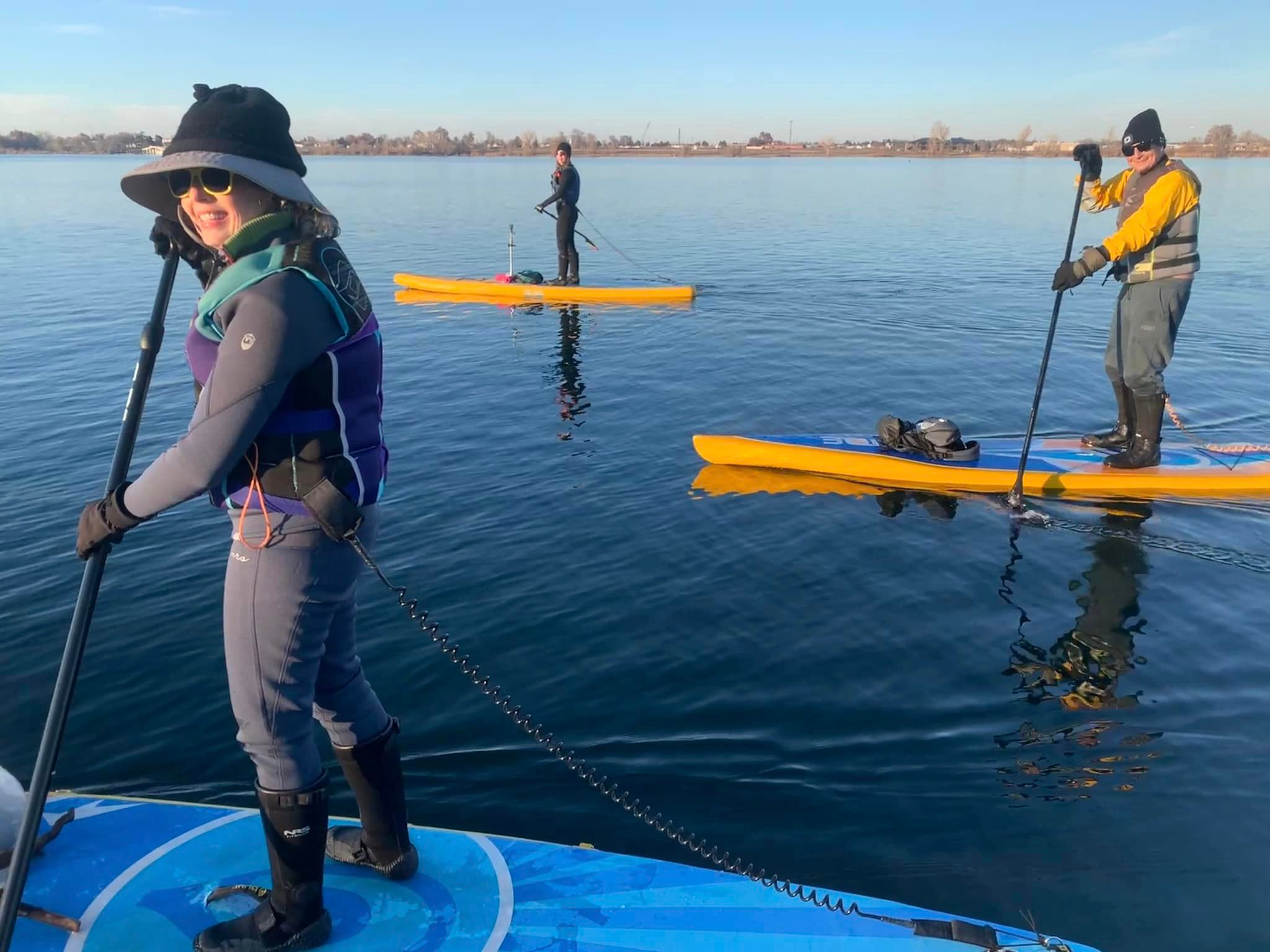 people on touring paddle boards