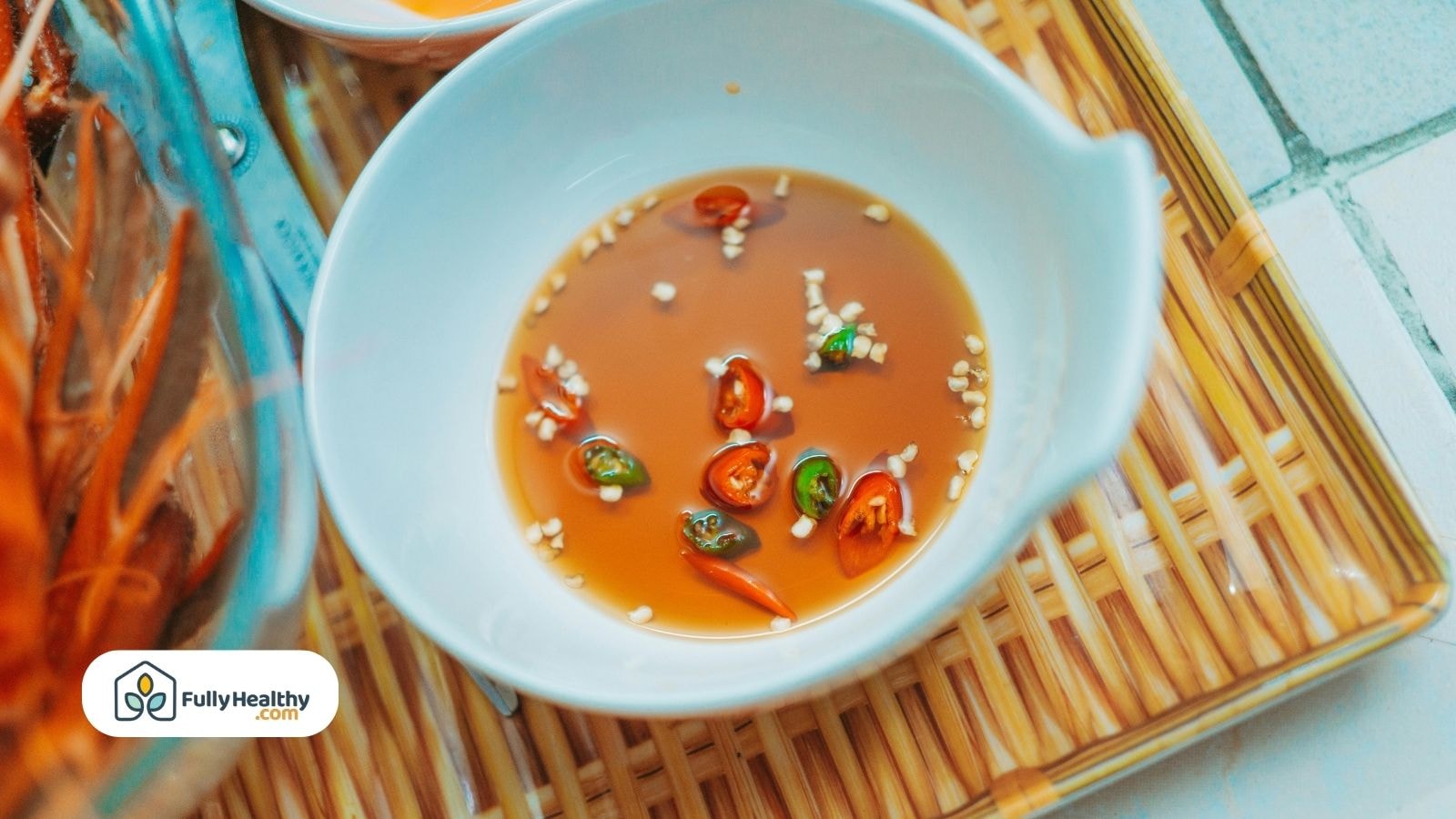 Fish sauce with chopped red and green chili peppers