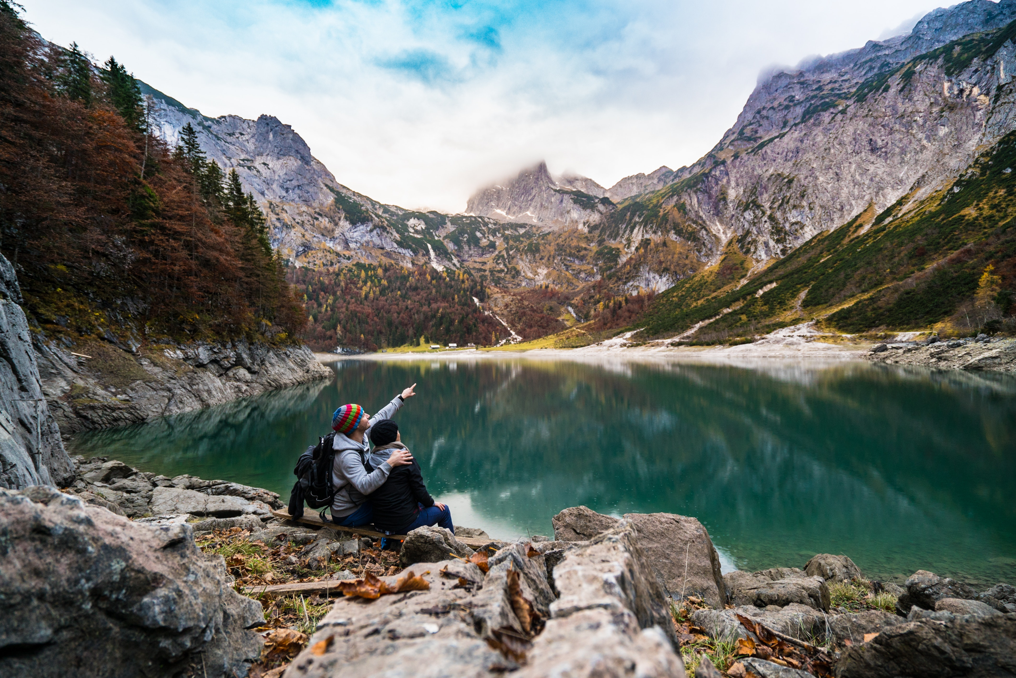 couple sitting by a lake