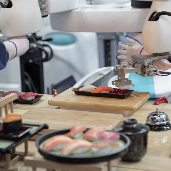 This photo shows service robots preparing sushi at a restaurant for customers