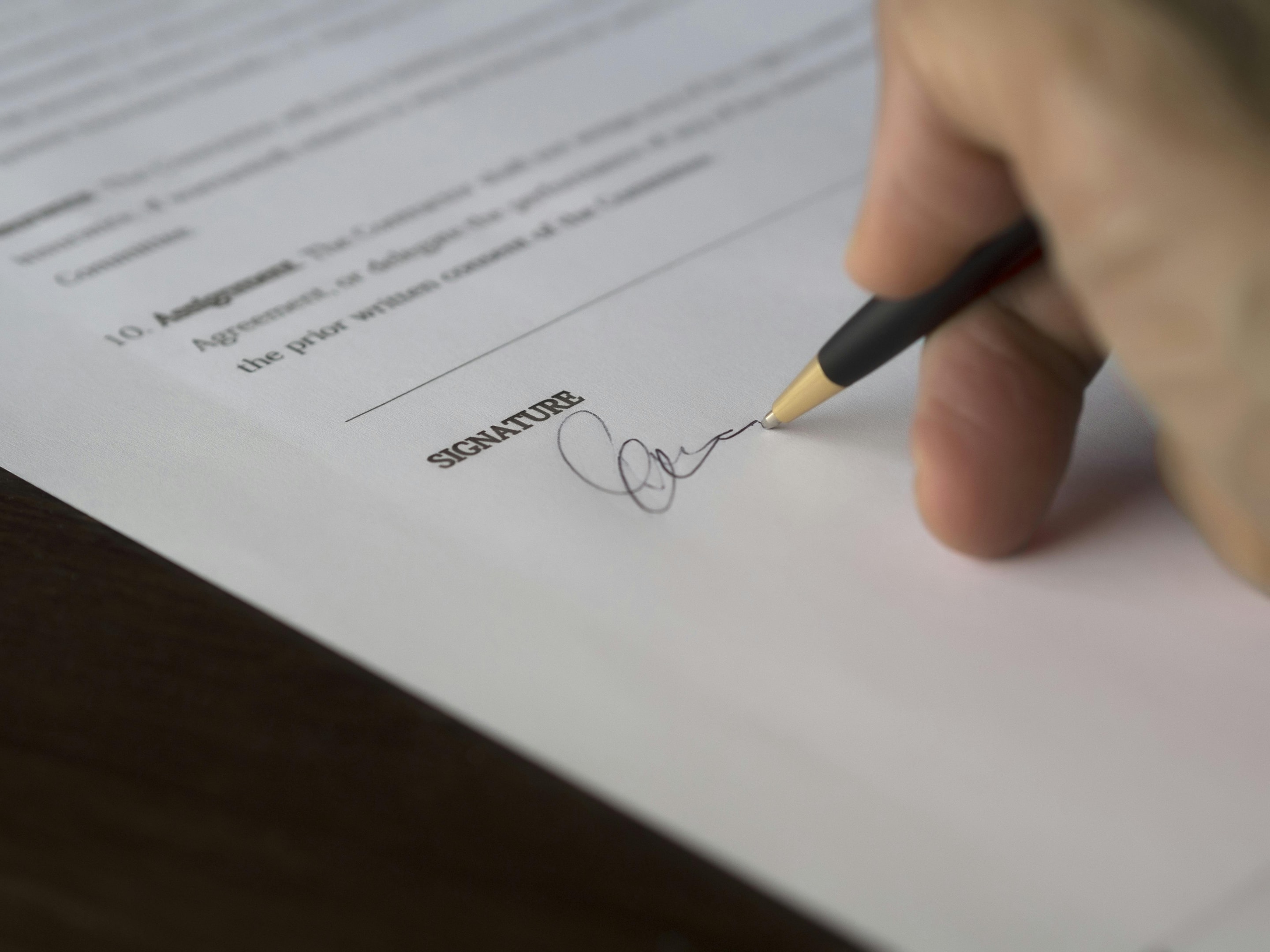 Paperwork being signed by real estate investor upon agreeing to "Sub To" Deal.
