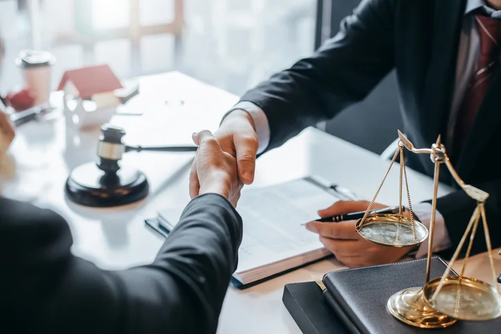 Lawyer shaking hands with a client