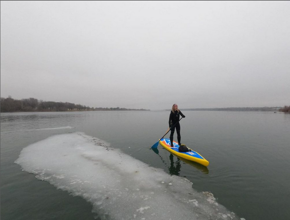 paddling a touring sup board