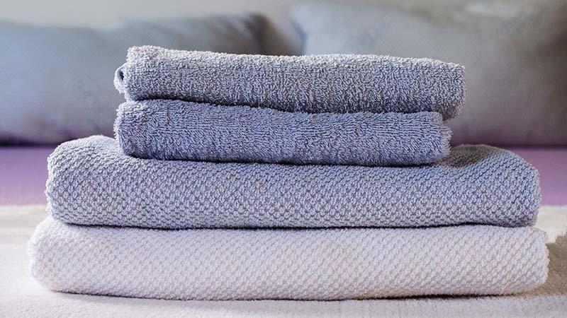 Low GSM towels set on top of high GSM towels