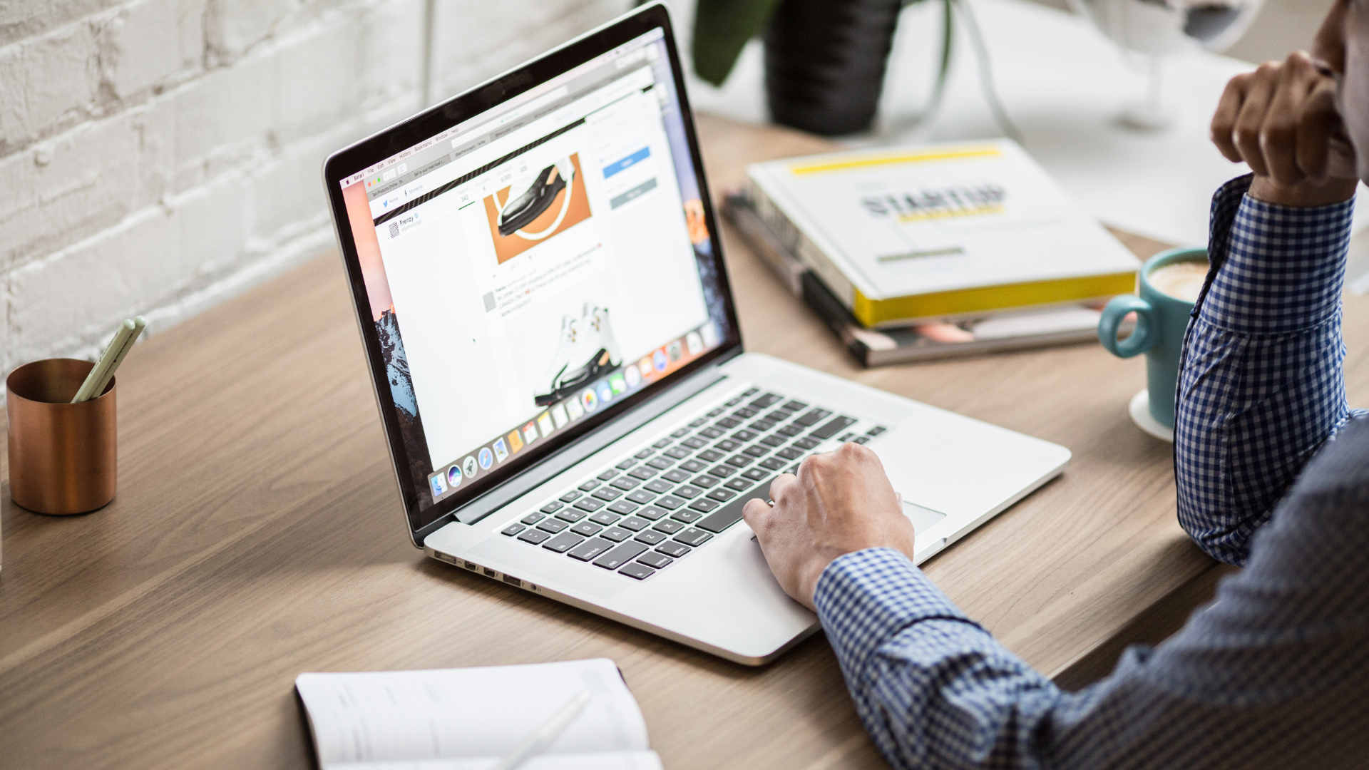 A person automating their cash flow with a laptop