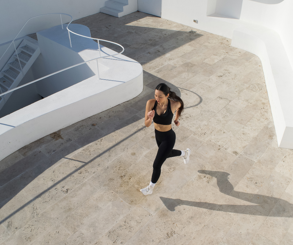 a woman running and working on her overall fitness