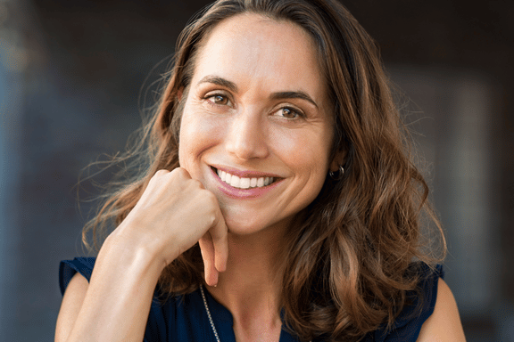 middle age woman with a bright beautiful restored smile