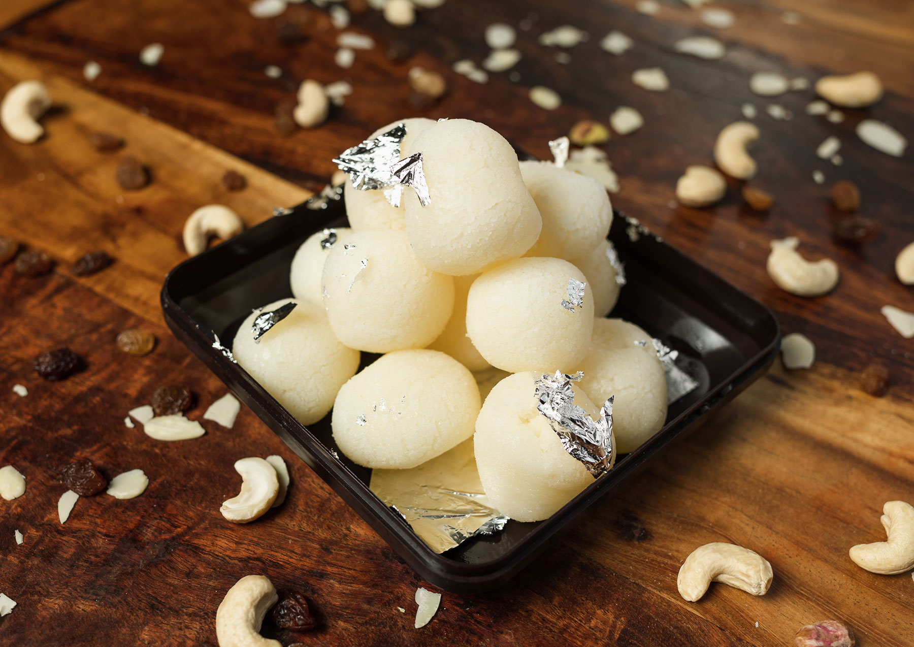 Rasgulla: Sweet Indian dessert with spongy cheese balls soaked in syrup.