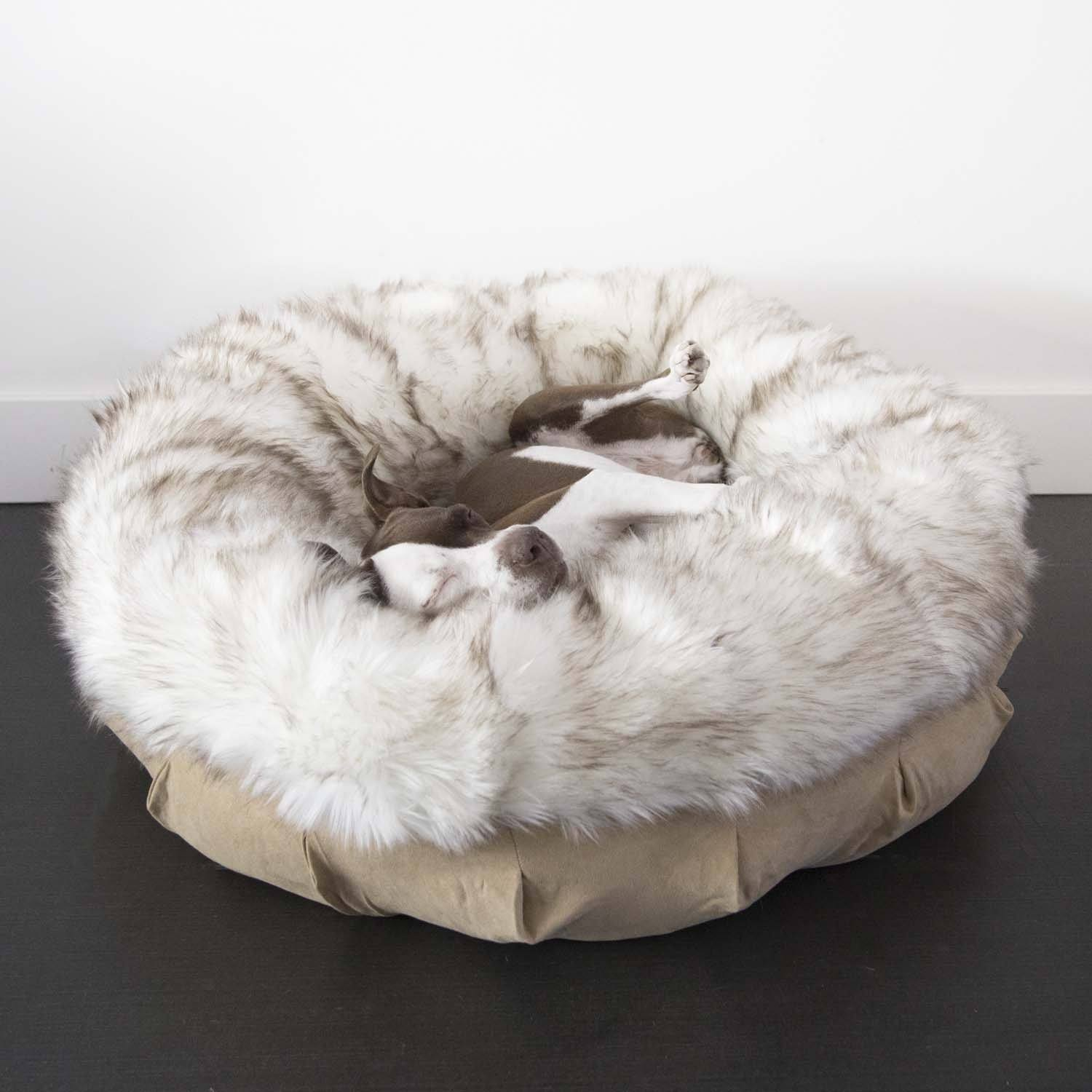 Ruby laying in the animals matter faux fur anxiety bed