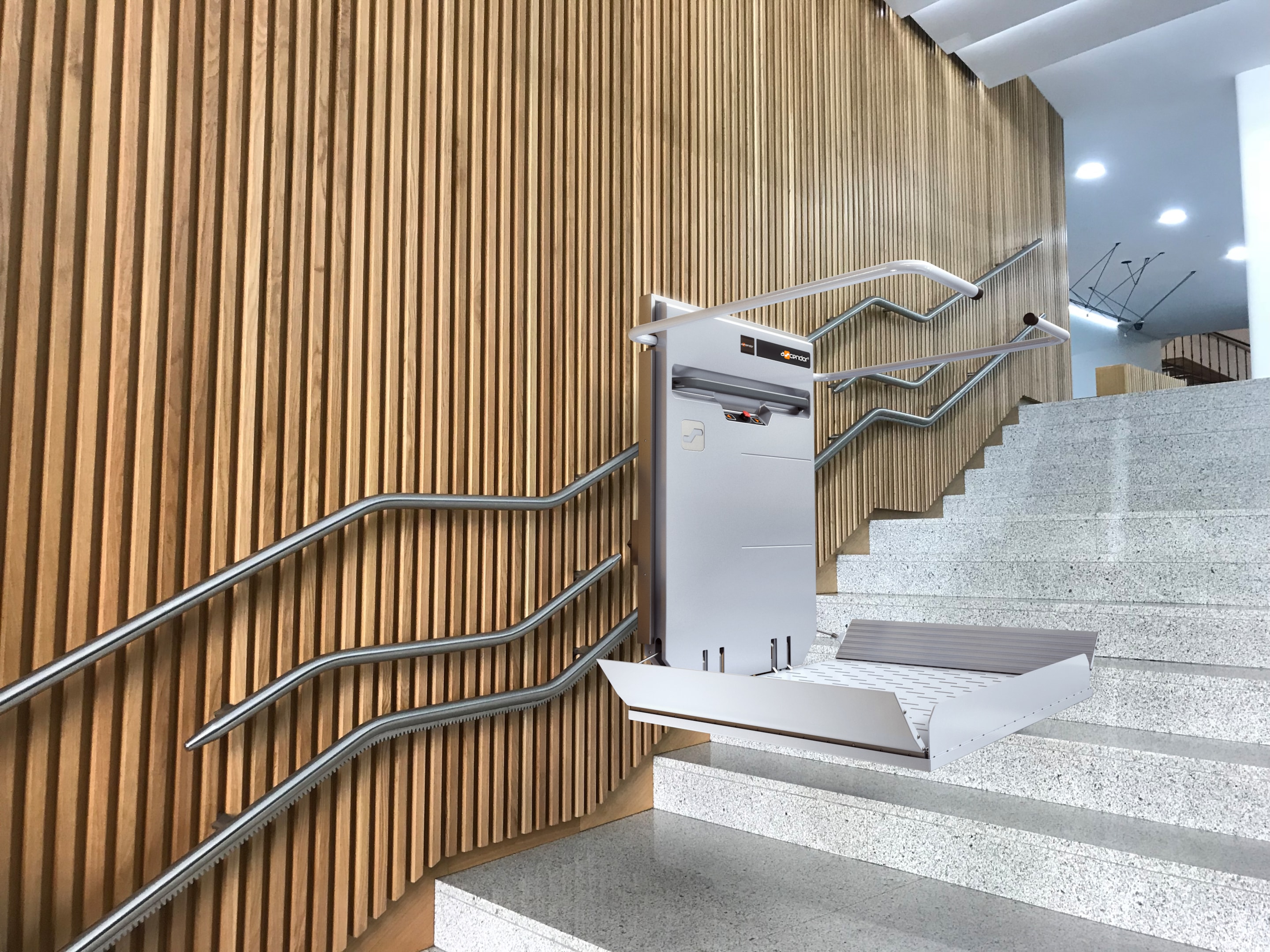 Key features of an inclined stair lift including safety features.