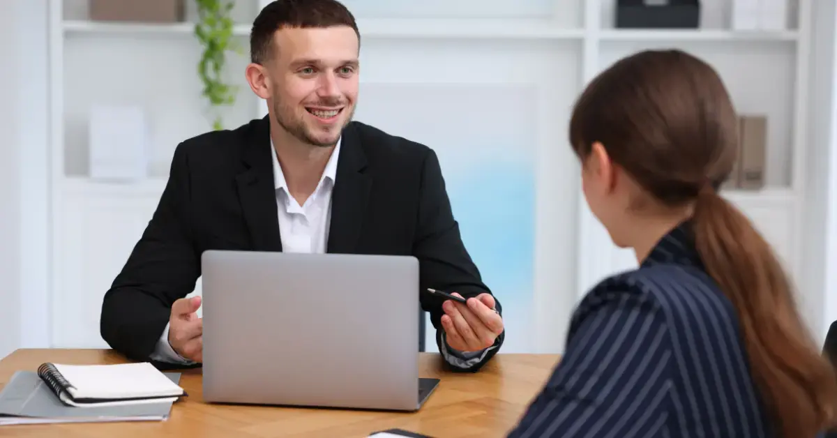 Self-employed woman discussing HSA retirement rules with a tax advisor.