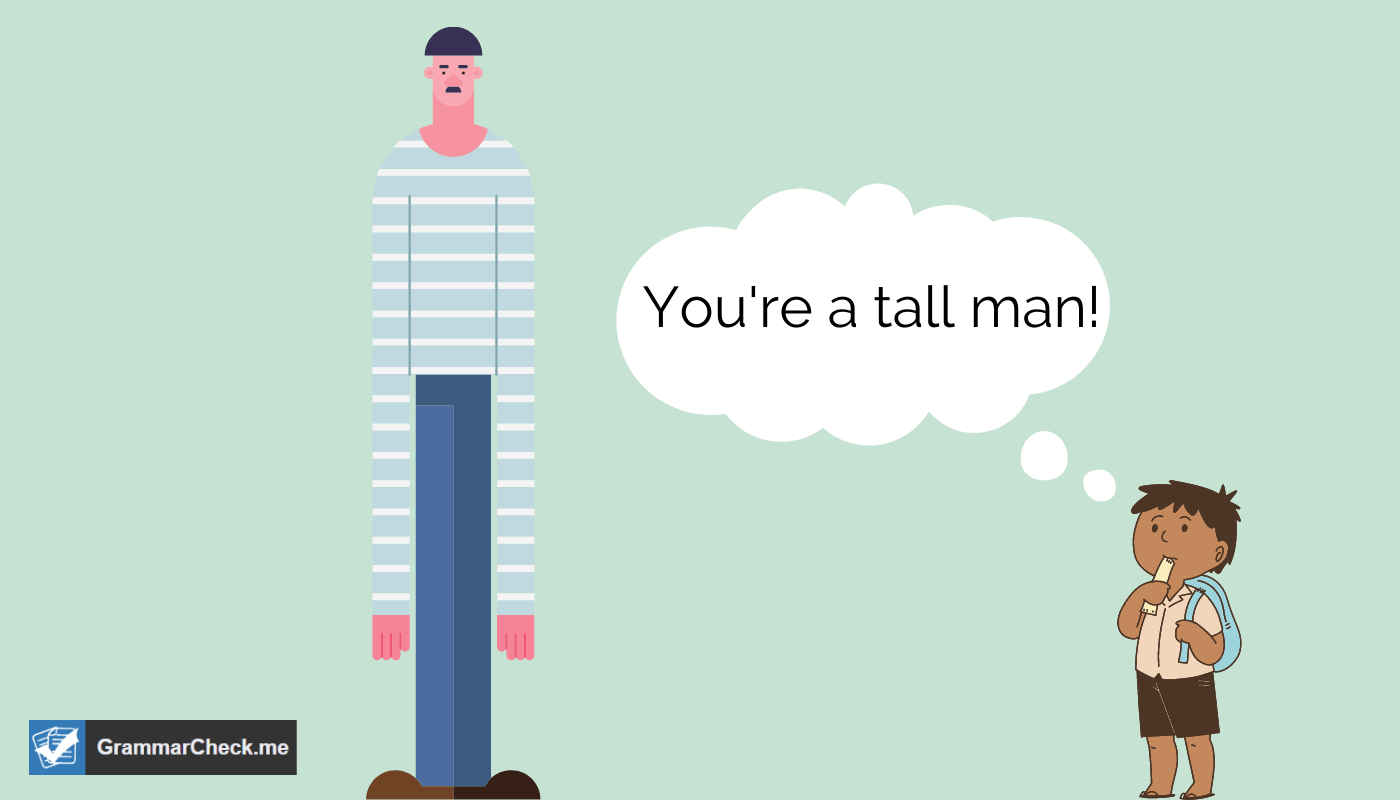 boy looking at a tall man with a green background
