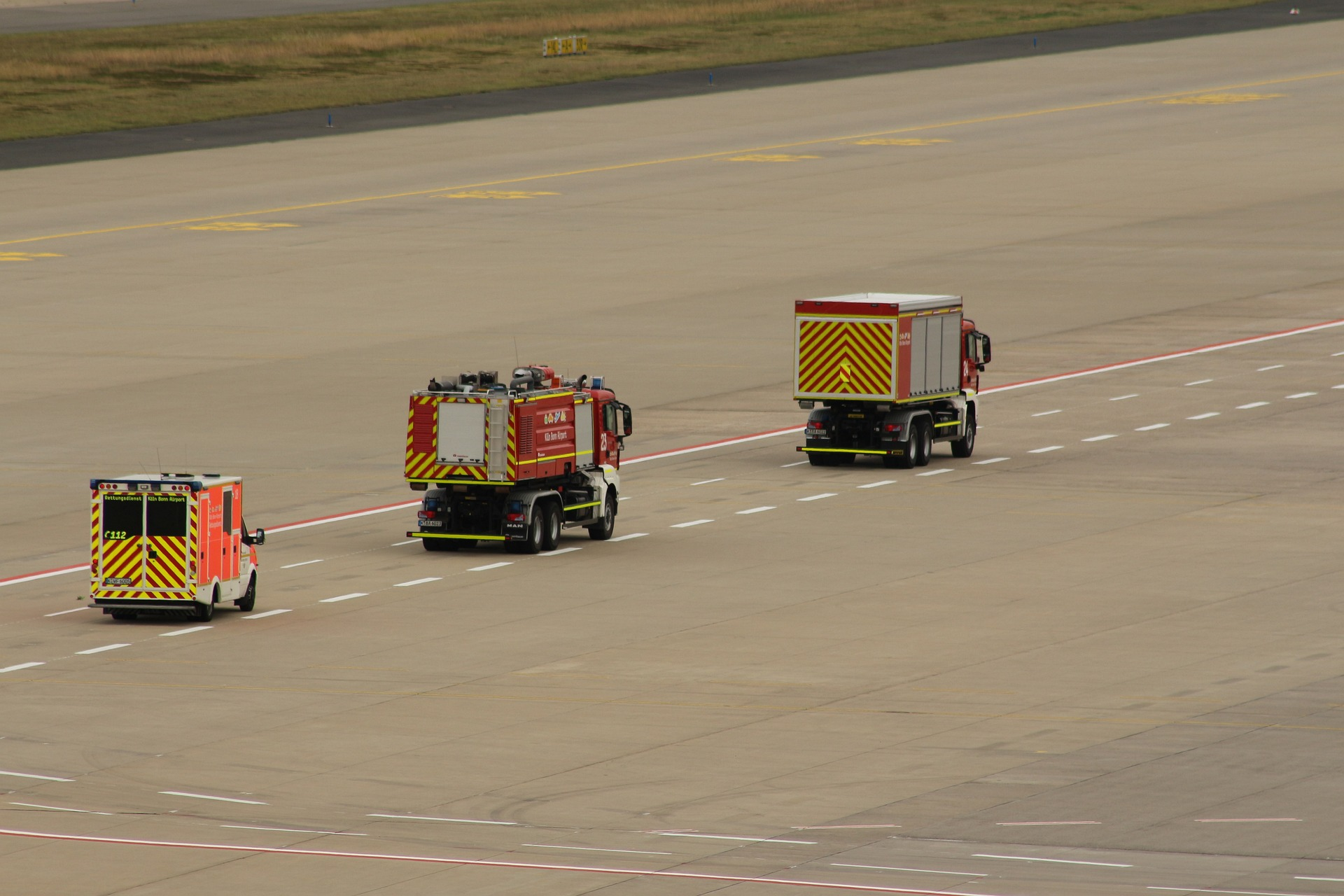 Crisis and disaster response team driving down an airport runway as a part of disaster management cycle training.