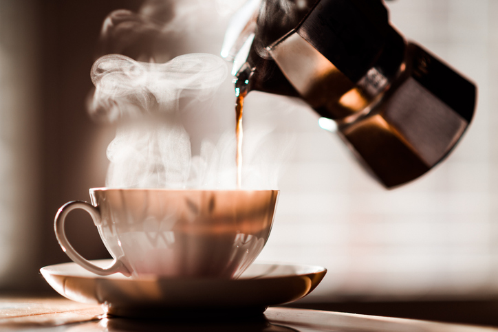 An image of coffee being poured into a cup.