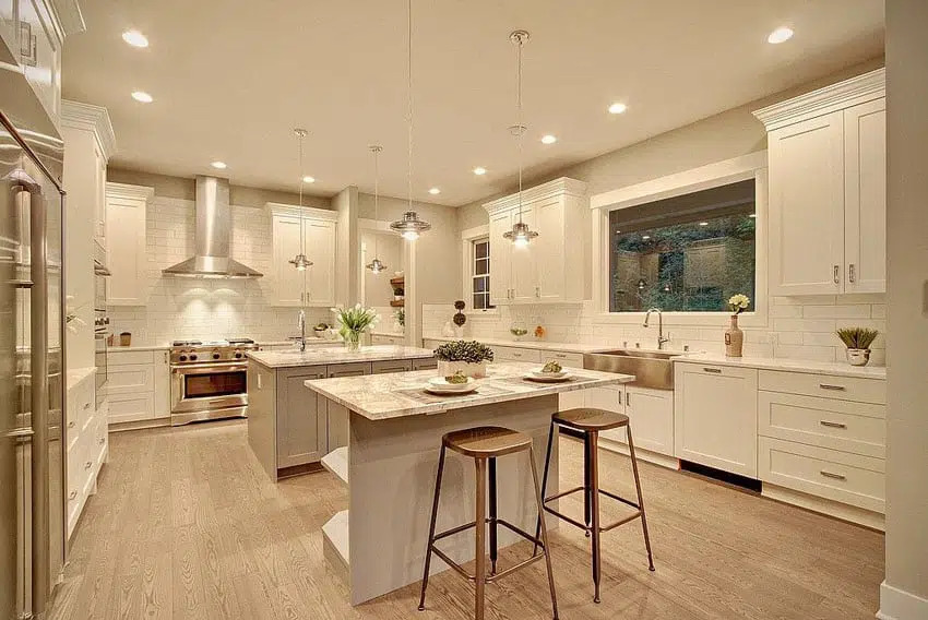 double kitchen islands with white sleek cabinetry