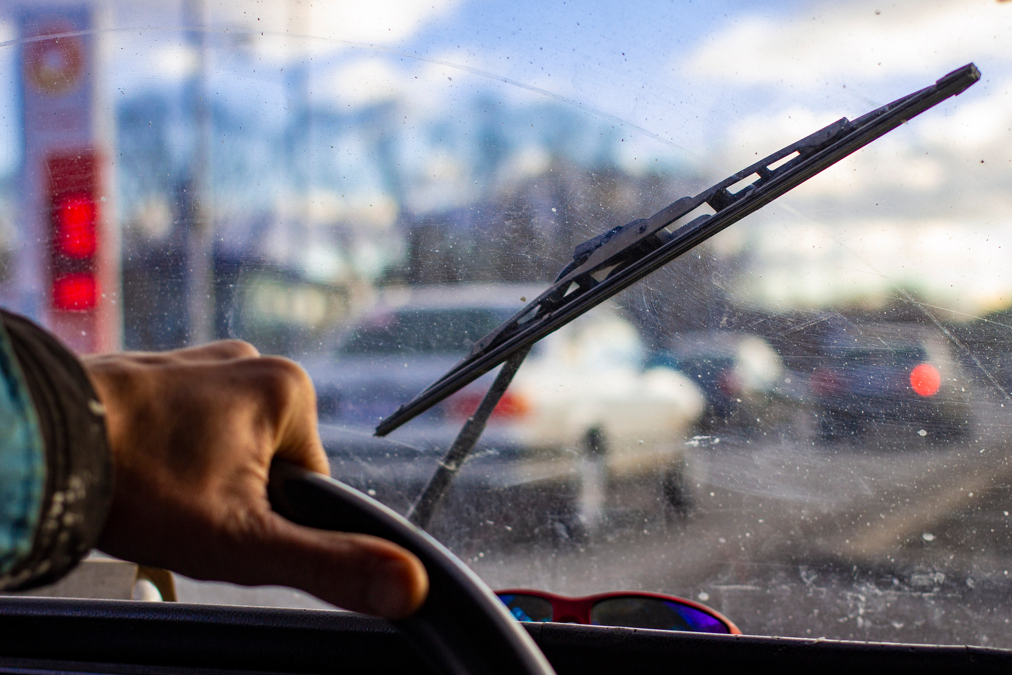 Deeply scratched and dirty windshield, view from inside