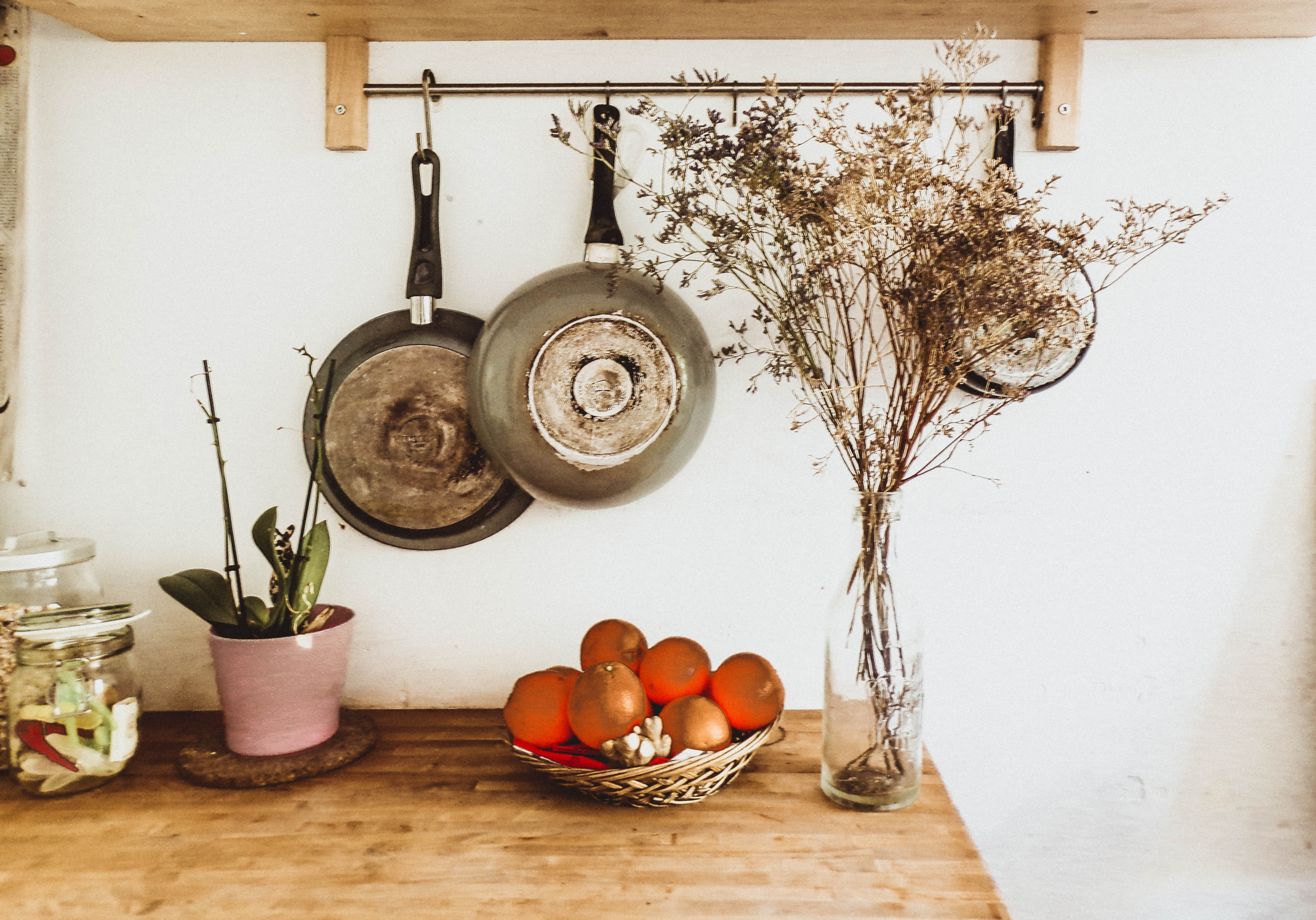 Kitchen space with wall-mounted pot rack
