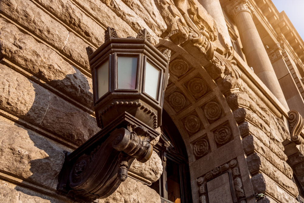 An example of both cast irdon and carved, decorative and functional corbels on an exterior wall