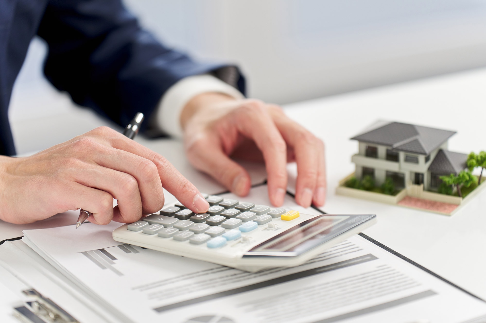 A buyer calculates costs and loan options when purchasing land, a key step in securing Land Loans in Australia.