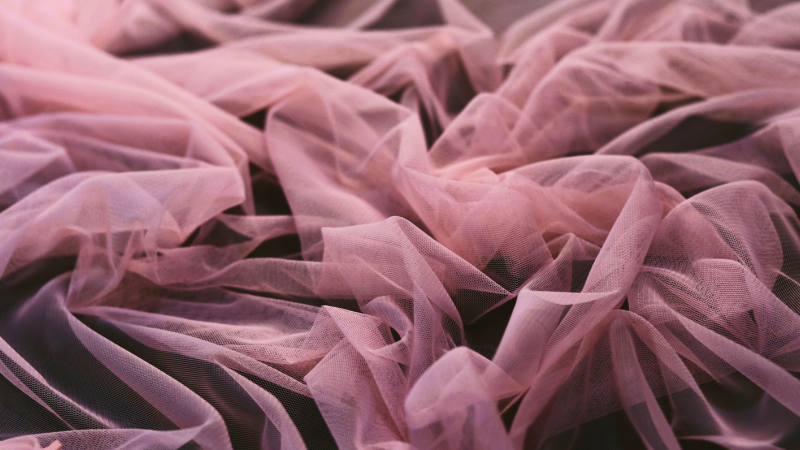 A close-up of a pink tulle fabric