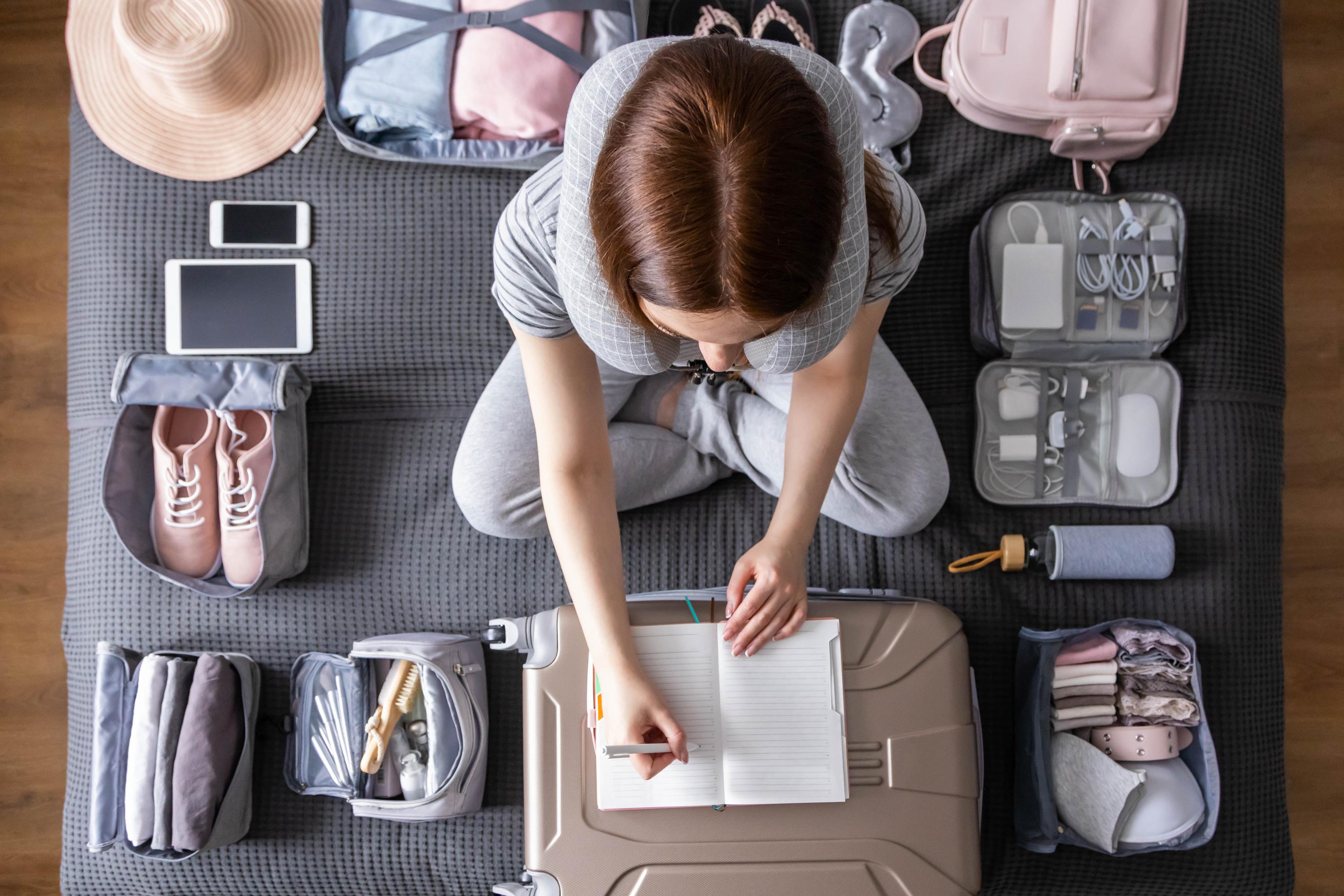 A woman makes a checklist to ensure she has everything she needs for rehab