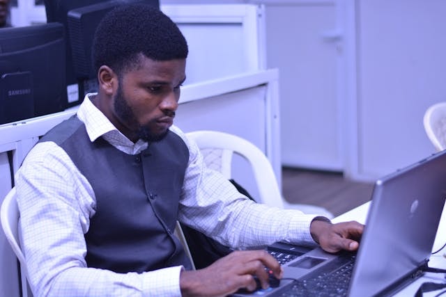 An entrepreneur busy on a laptop