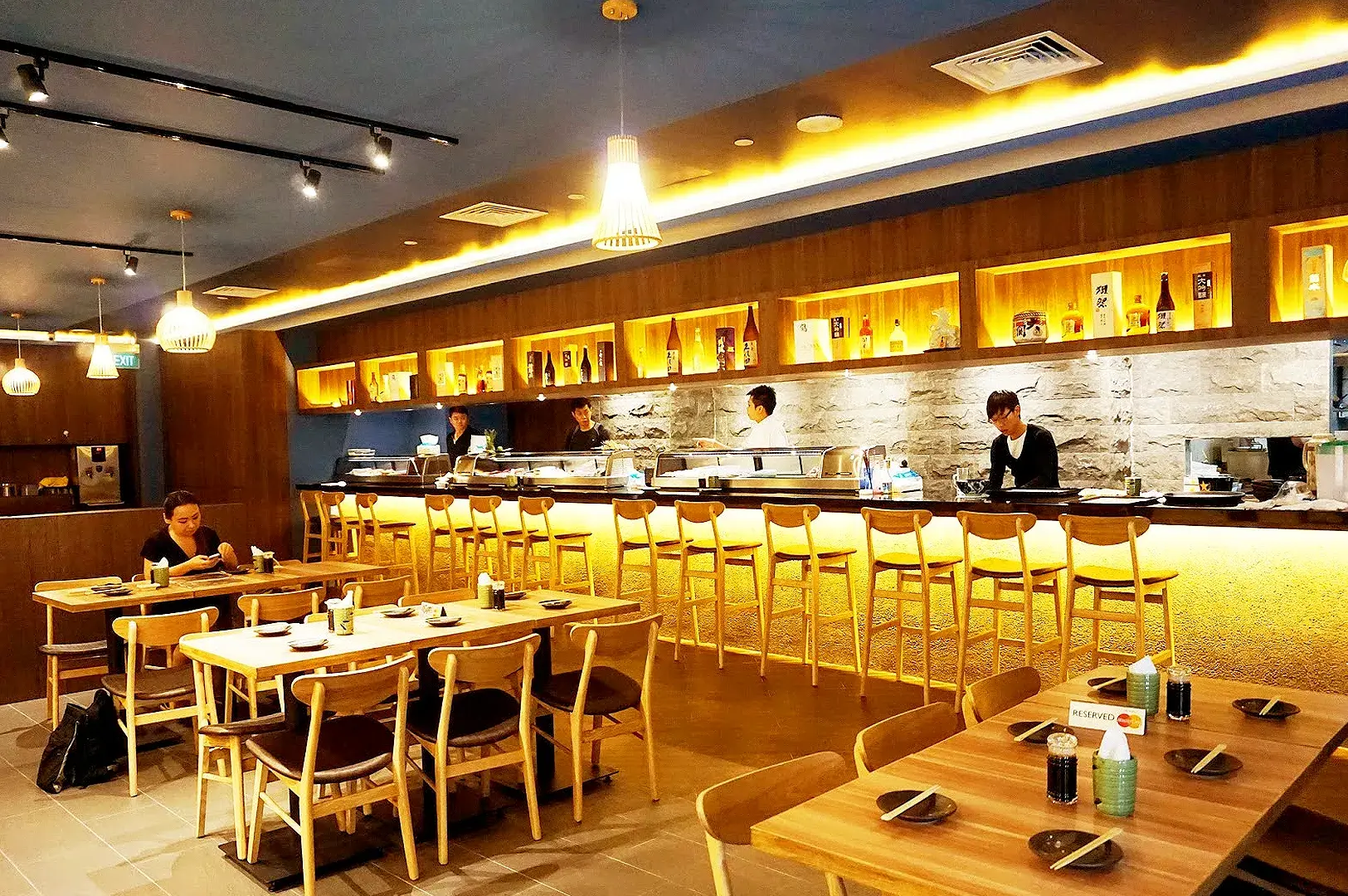 The Sushi Bar restaurant interior near Orchard MRT with Japanese dining tables and sushi counter