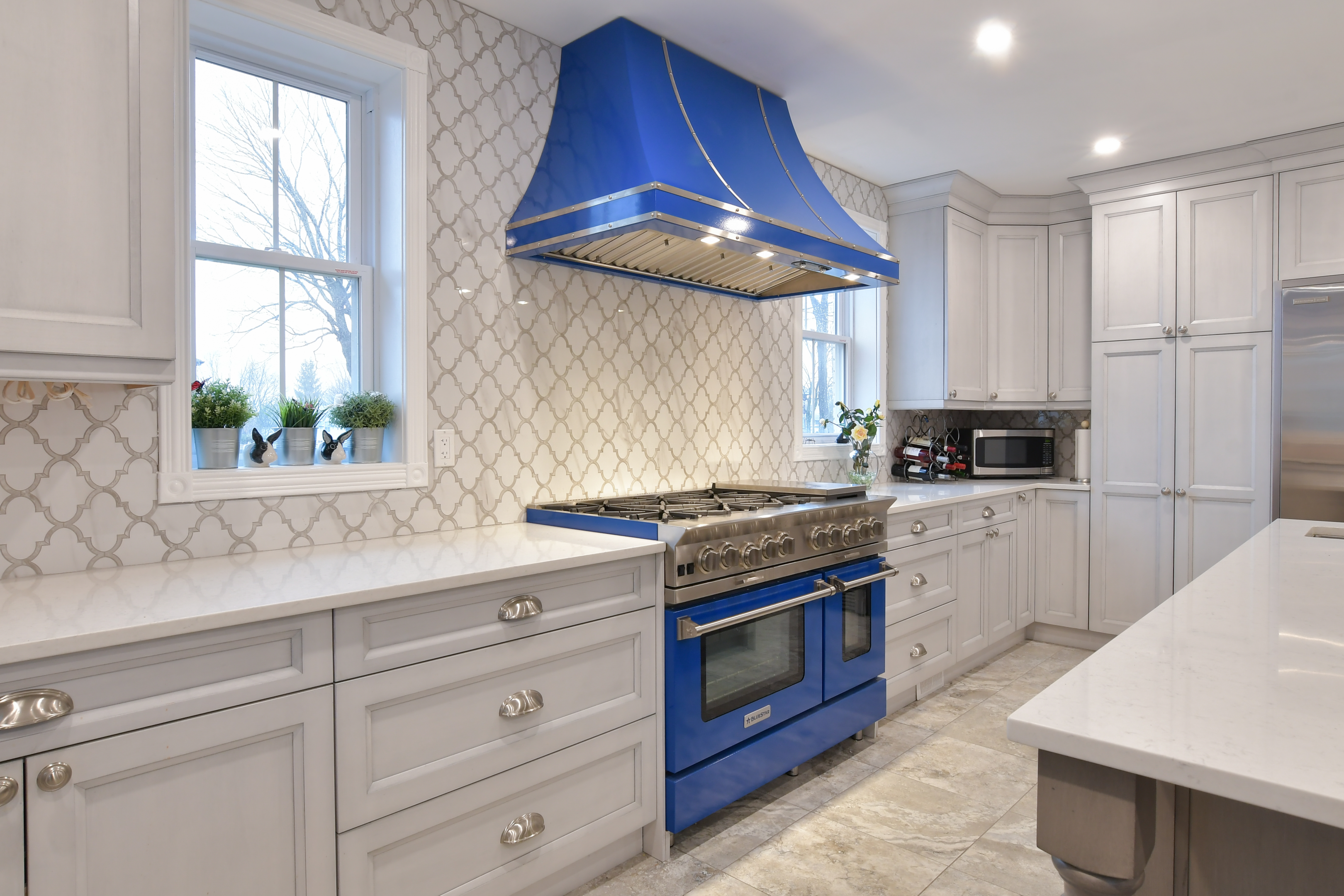feminine coastal kitchen with blue oven