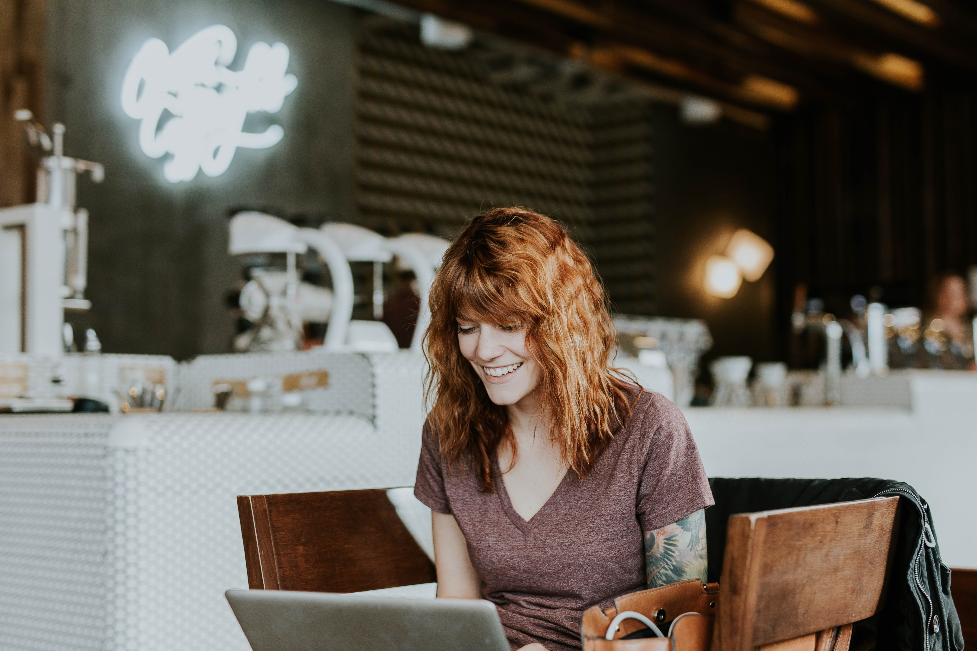 Lady Laughing at Computer