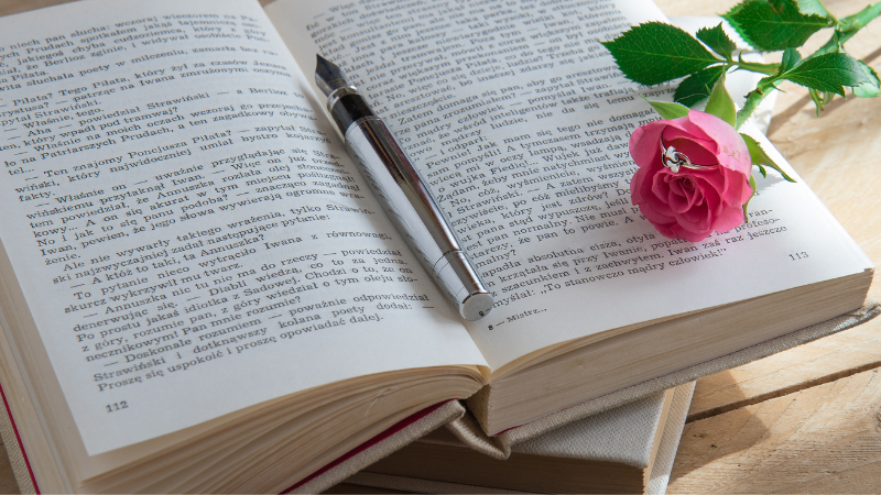 a beatiful book with a rose flower