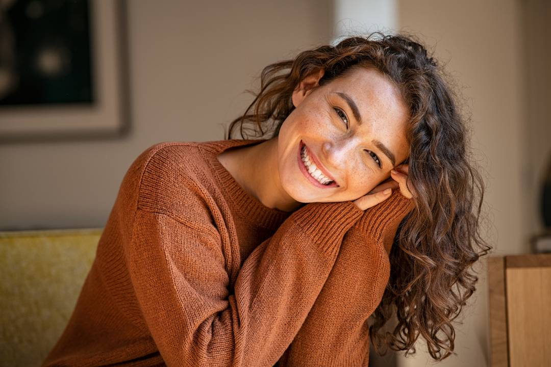 a women smiling thinking about how nac may help with psychiatric disorders, acute renal failure and heart disease - The Good Stuff