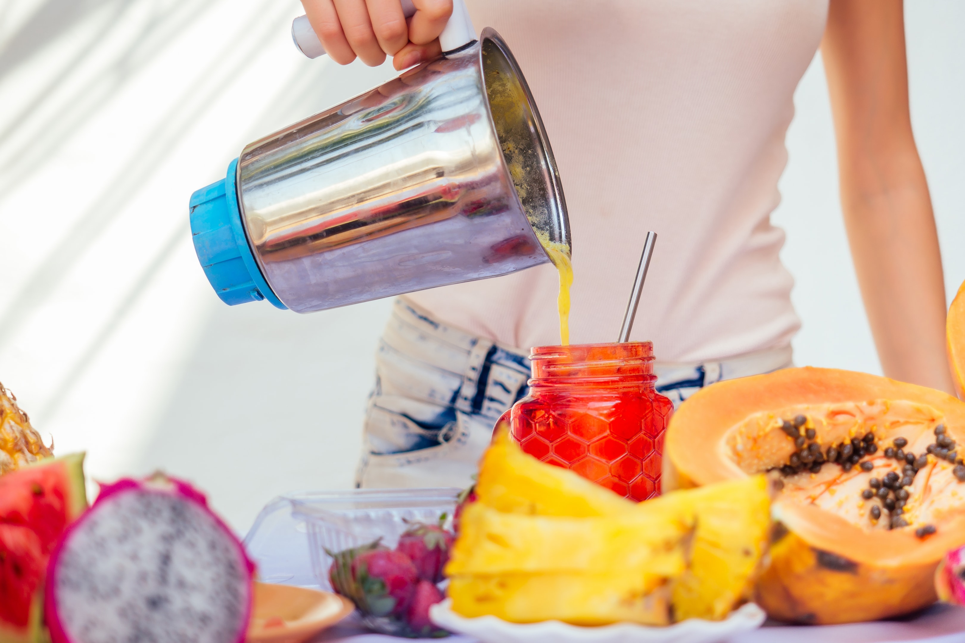 making a smoothie with fresh fruit 