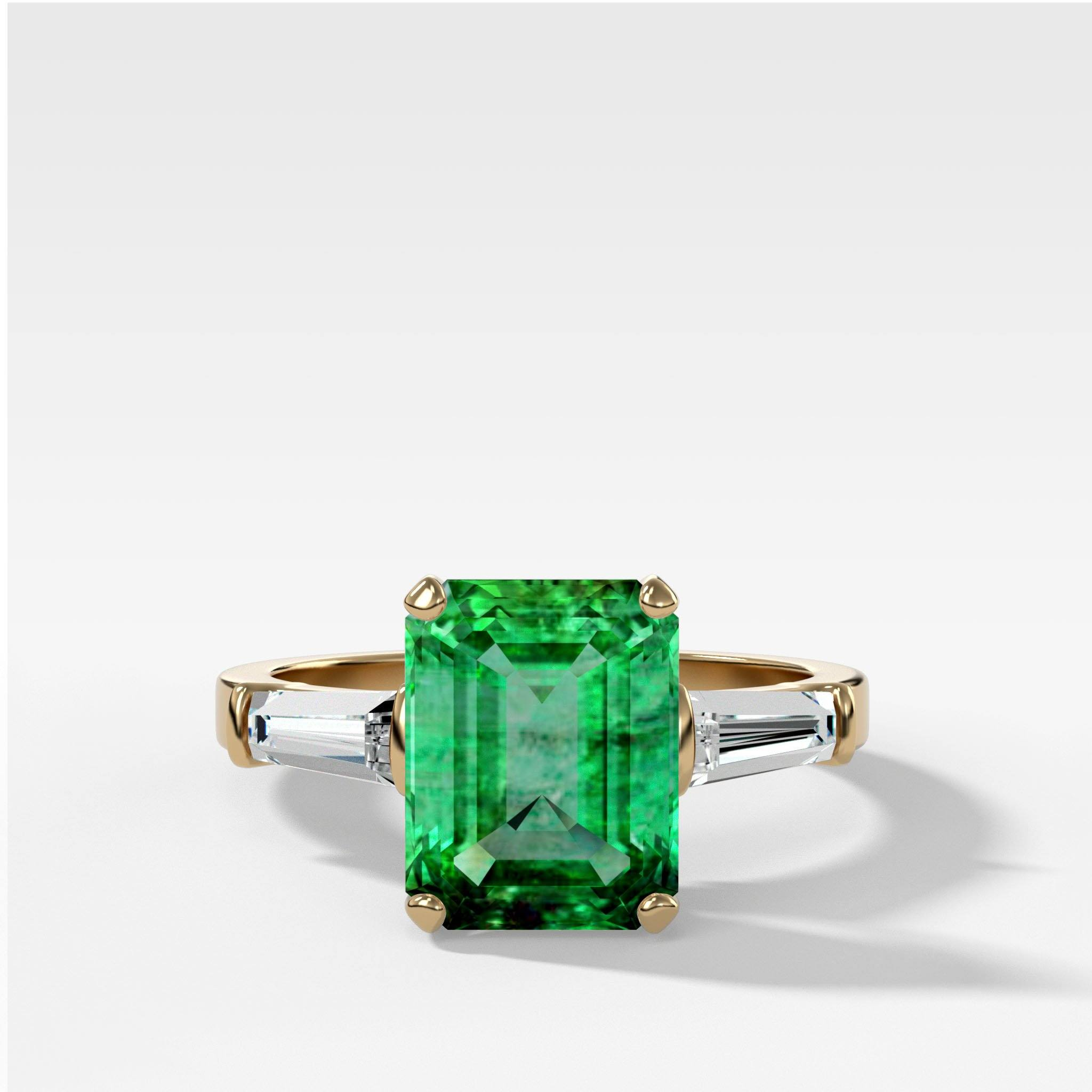 GOODSTONE Emerald Cut Emerald Translunar Ring with Tapered Baguette Diamond sides