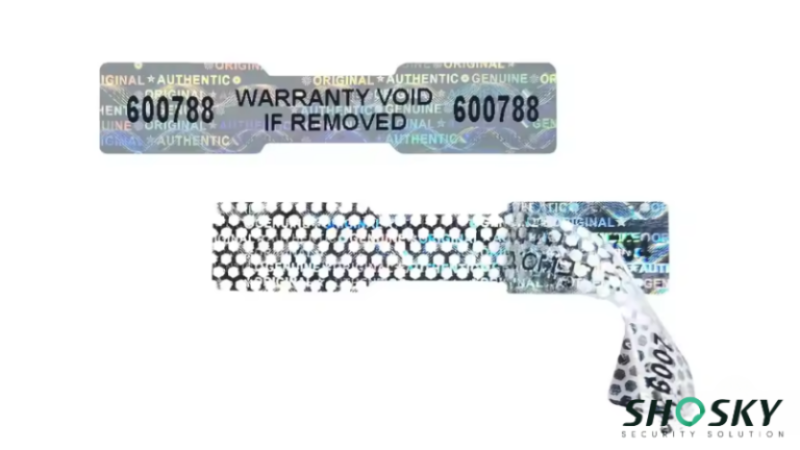 “Warranty Void” label reveals hexagonal damage, signaling unauthorized removal attempt