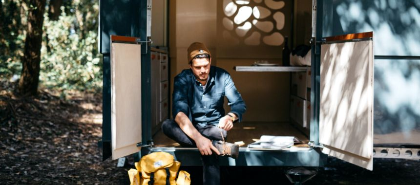 A man preparing at the front door to go outside his tiny home. Source: Unsplash