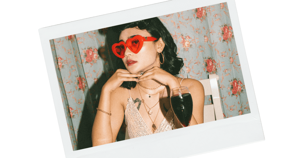 A woman on a date with a glass of wine in front of her.