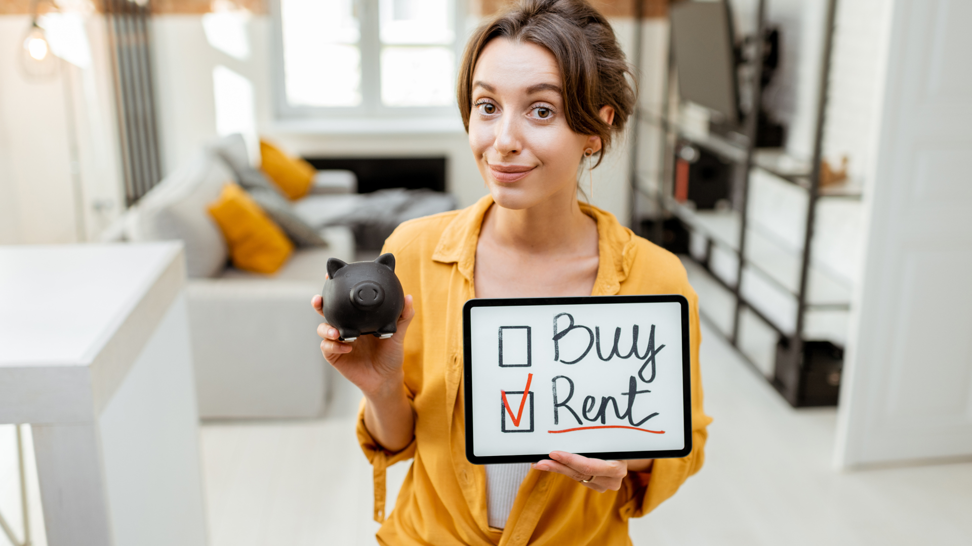 millennial holding placard with rent in check