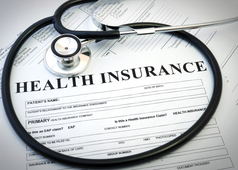 Stethoscope and health insurance form