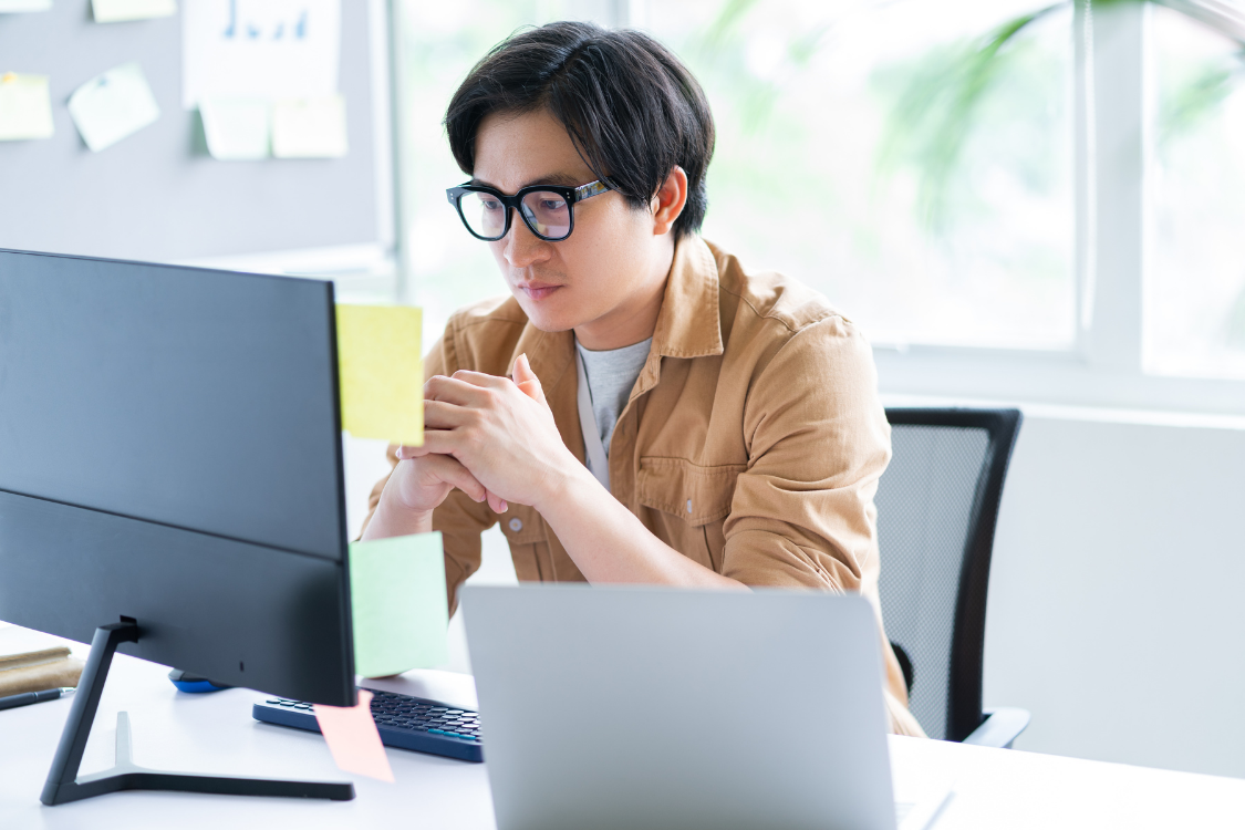 Filipino applicant concentrating during an online job interview from home