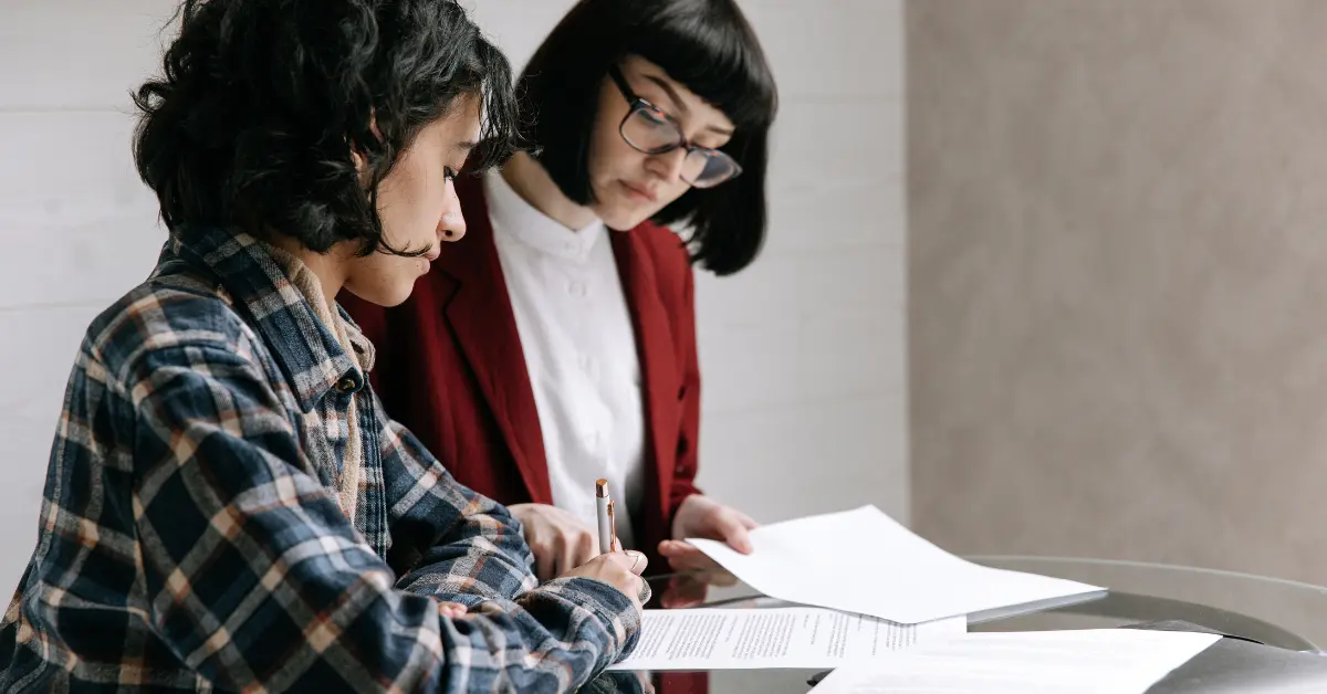 OnlyFans creator consulting with a tax professional about LLC disregarded entity tax benefits.