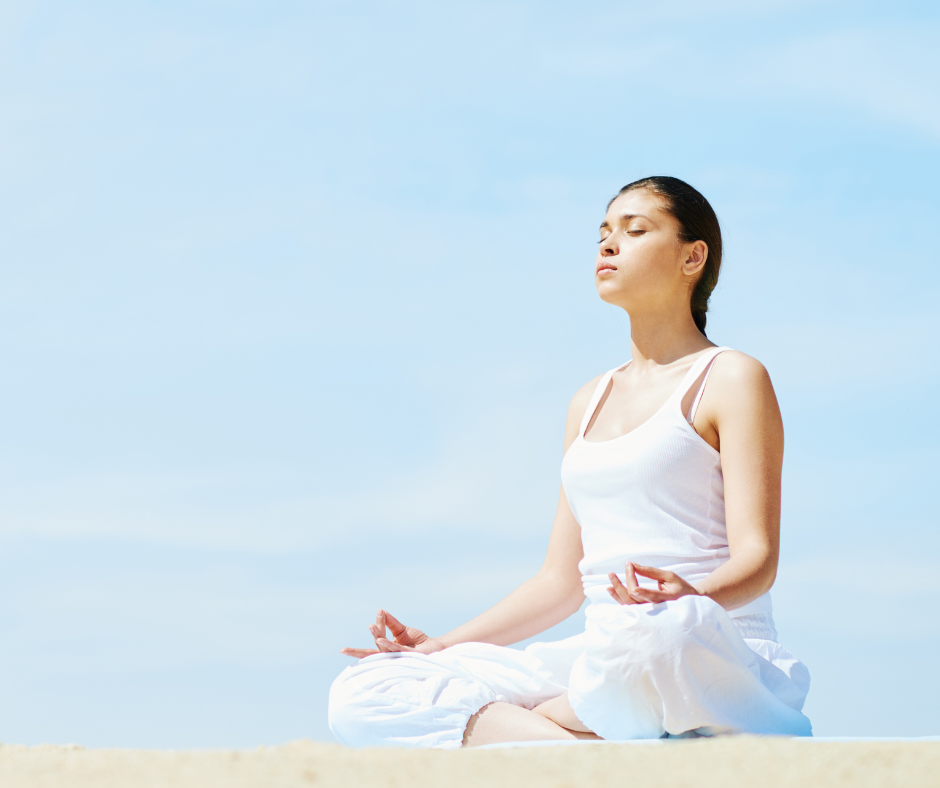 A person meditating and focusing on their breathing