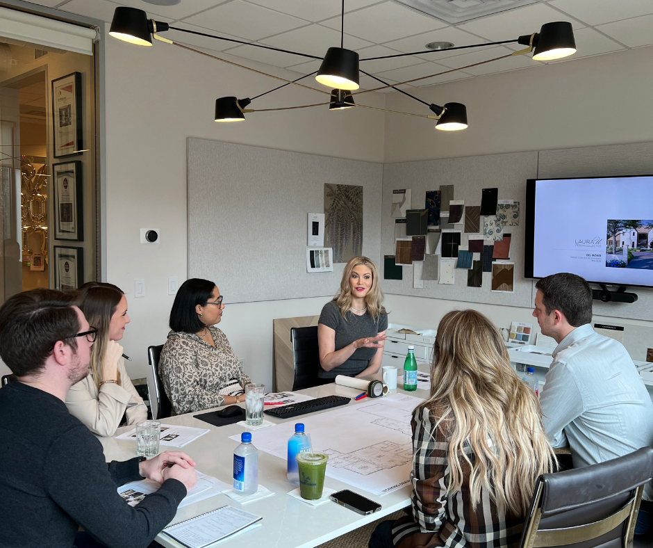 interior designers meeting with other interior designers and an interior design mentor in a studio